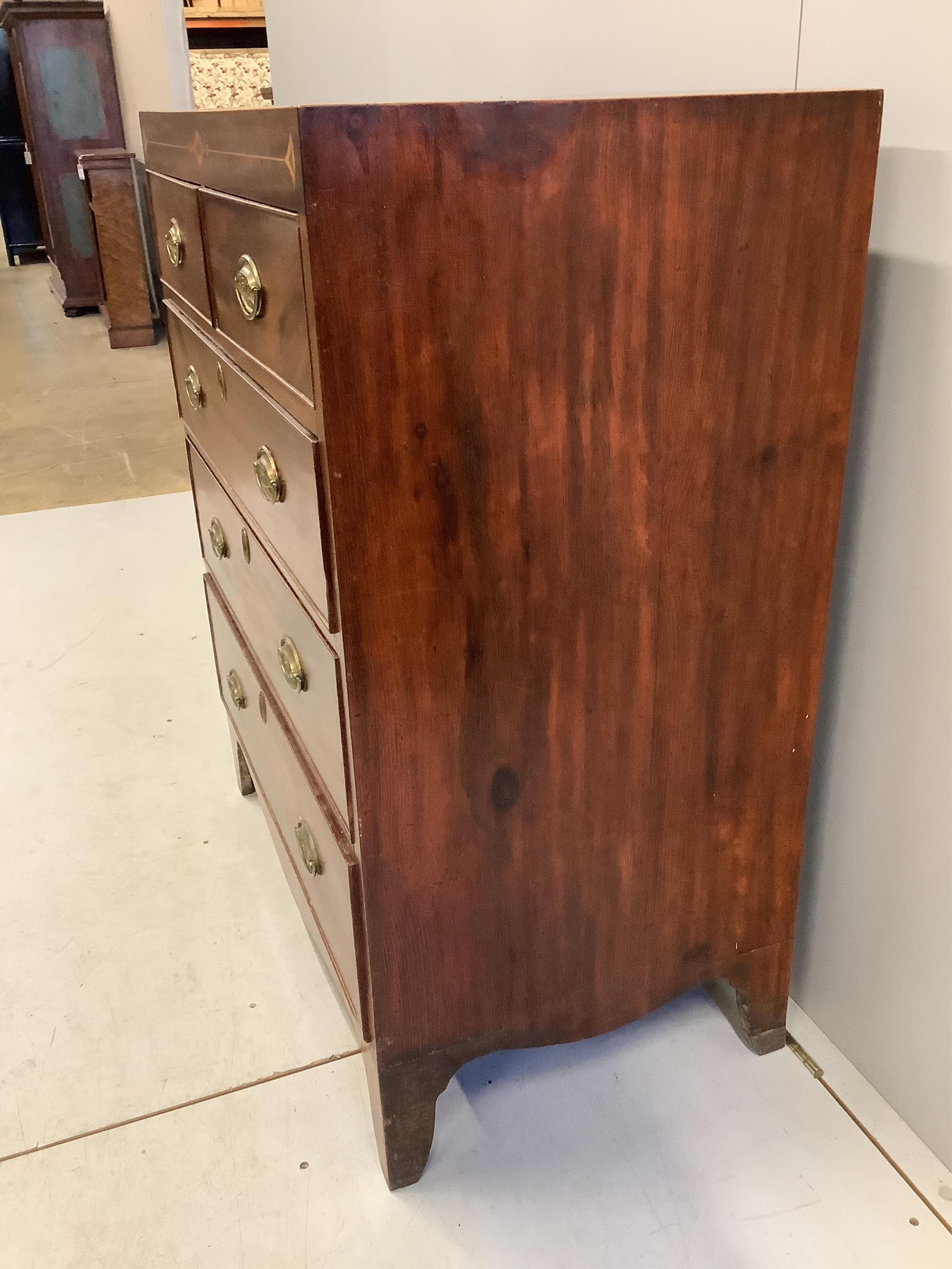 A Regency inlaid mahogany chest, width 87cm, depth 50cm, height 106cm. Condition - fair, top slightly faded, spot and ring marked.